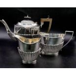 A SOLID SILVER HALF FLUTED ART DECO TEA SET WITH TEA POT, SUGAR BOWL AND CREAMER IN LOVELY CONDITION