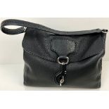 A Large Prada Black Leather handbag with Hook Clasp. Monogram interior with zipped compartment. 30 x