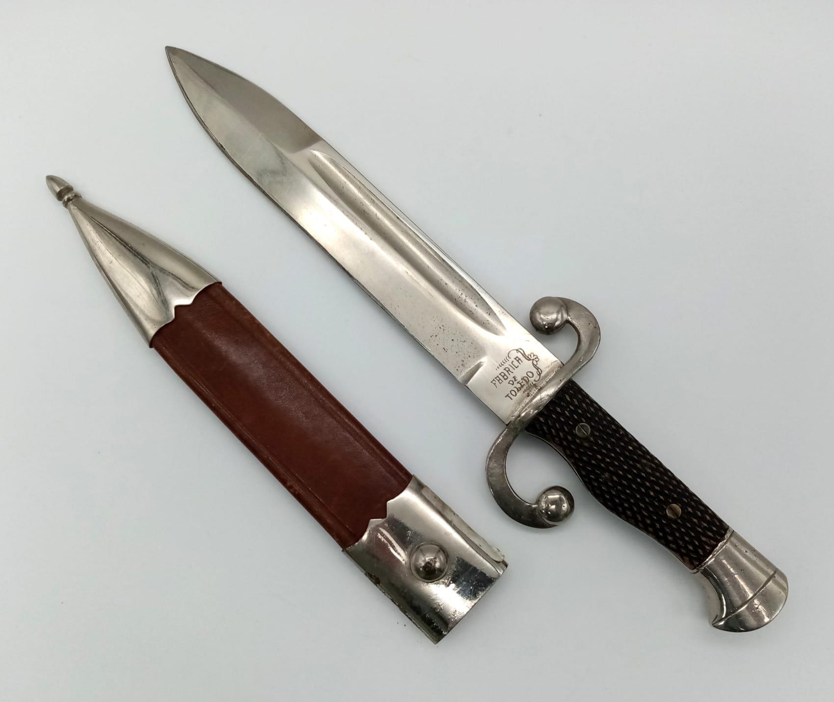 A Vintage Toledo Dagger with Scabbard. In good condition but please see photos. 33cm total length.