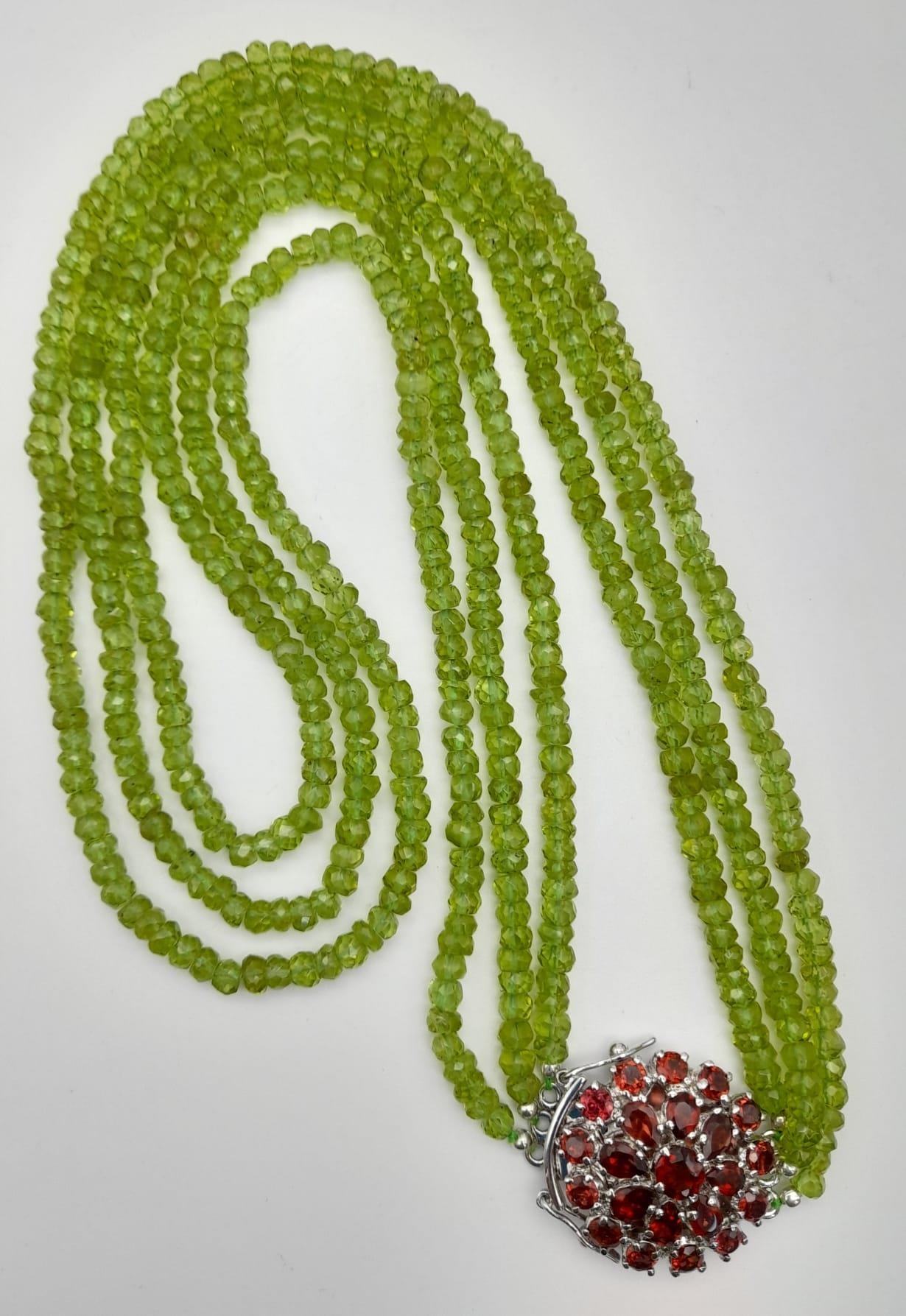 3 Row Peridot Gemstone Necklace with Garnet Clasp in 925 Silver, 440cts in total , Comes on side