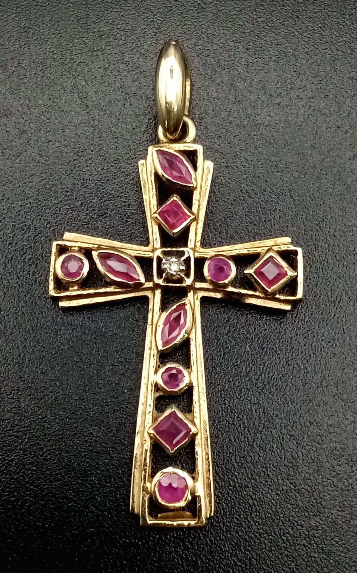 A 9K yellow gold, diamond and ruby set, cross pendant. Length: 29 mm, weight: 1.7 g. - Image 2 of 4