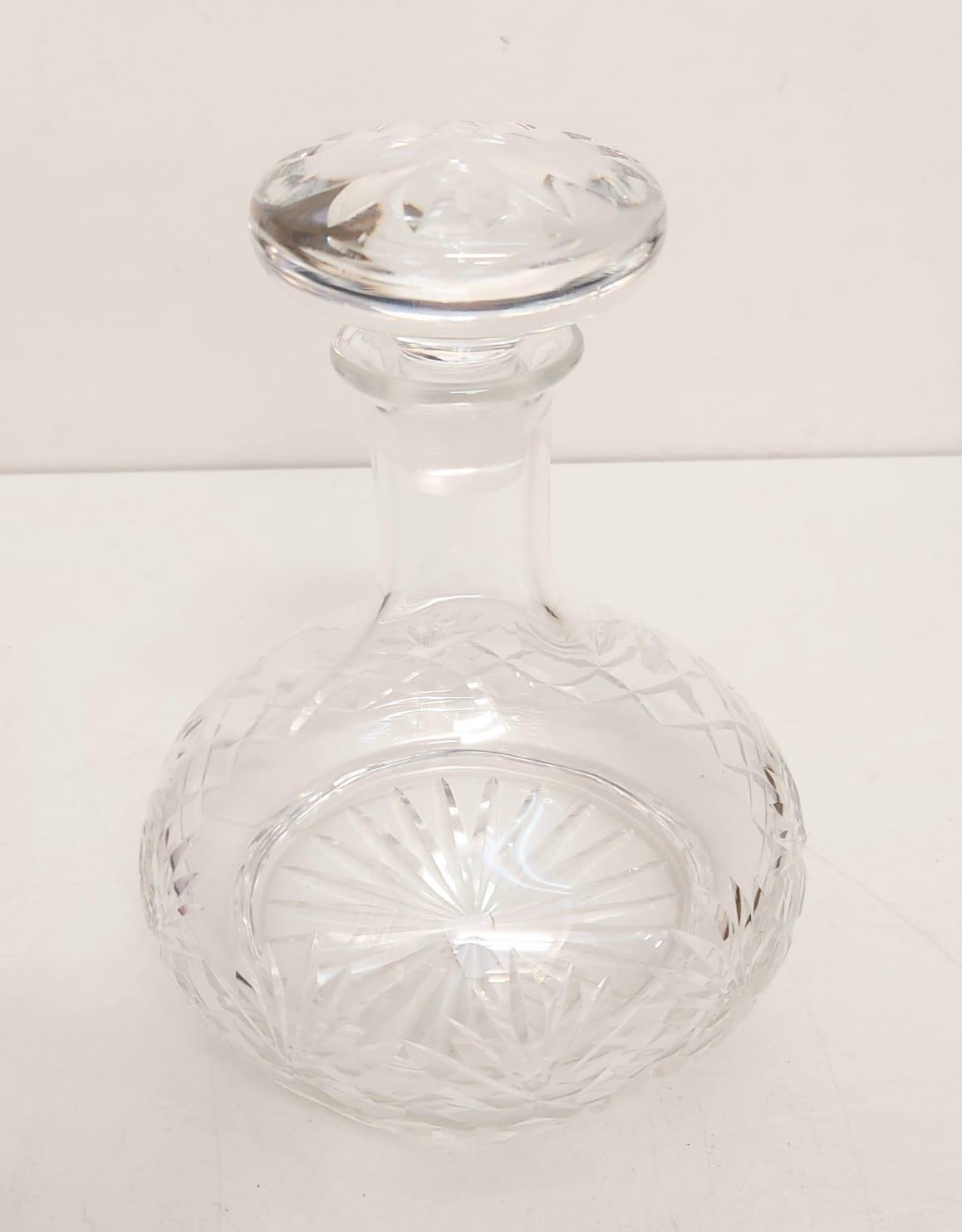 A tastefully decorated cut glass decanter-possibly Wedgewood, 22cm tall