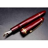 A Mont Blanc 4810 Burgundy Fountain Pen with 14K White Gold Nib. Comes in a Mont Blanc Box. Ref: