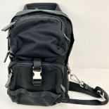 A Small Prada Backpack. Two outer zipped compartments and one zipped inner compartment. Silver