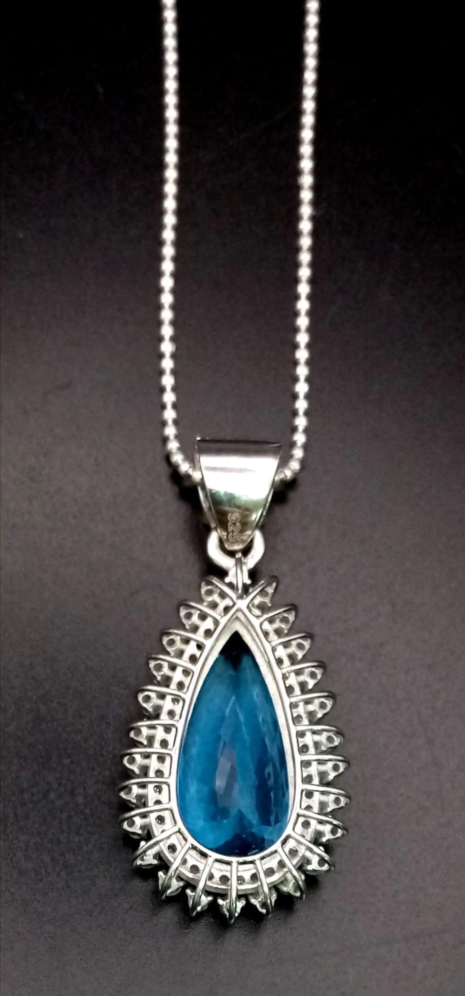 A Natural 10cts Pear cut Blue Topaz Drop Pendant, set in 925 silver decorated with 1.50cts - Image 2 of 4