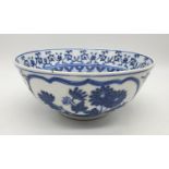 An early Chinese SIGNED porcelain bowl hand painted blue and white floral design, 20cm diameter