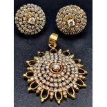 A Diamond Brooch and Earring Set. 4ct of diamonds spread over a circular pendant and earrings. Set