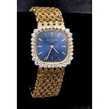 A Patek Phillipe 18K Gold and Diamond Ladies Dress Watch. 18k gold mesh bracelet. Gold and diamond