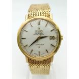 A 1960s 18K Solid Gold Omega Constellation Gents Watch. 18K gold strap and case - 36mm. White dial