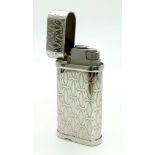 A white metal CARTIER lighter. Dimensions: 6 x 3 x 1.3 cm.