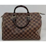 A Louis Vuitton Monogram Canvas and Leather Checked Small Tote Bag. Gilded hardware. Red interior.