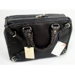 A Celine Brown Leather Handbag. Rectangular shape with silver-tone hardware. Cloth interior with