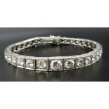 A Time-Stopping Graduated 6ct (approx) Diamond and Platinum Ladies Bracelet. 32 brilliant round