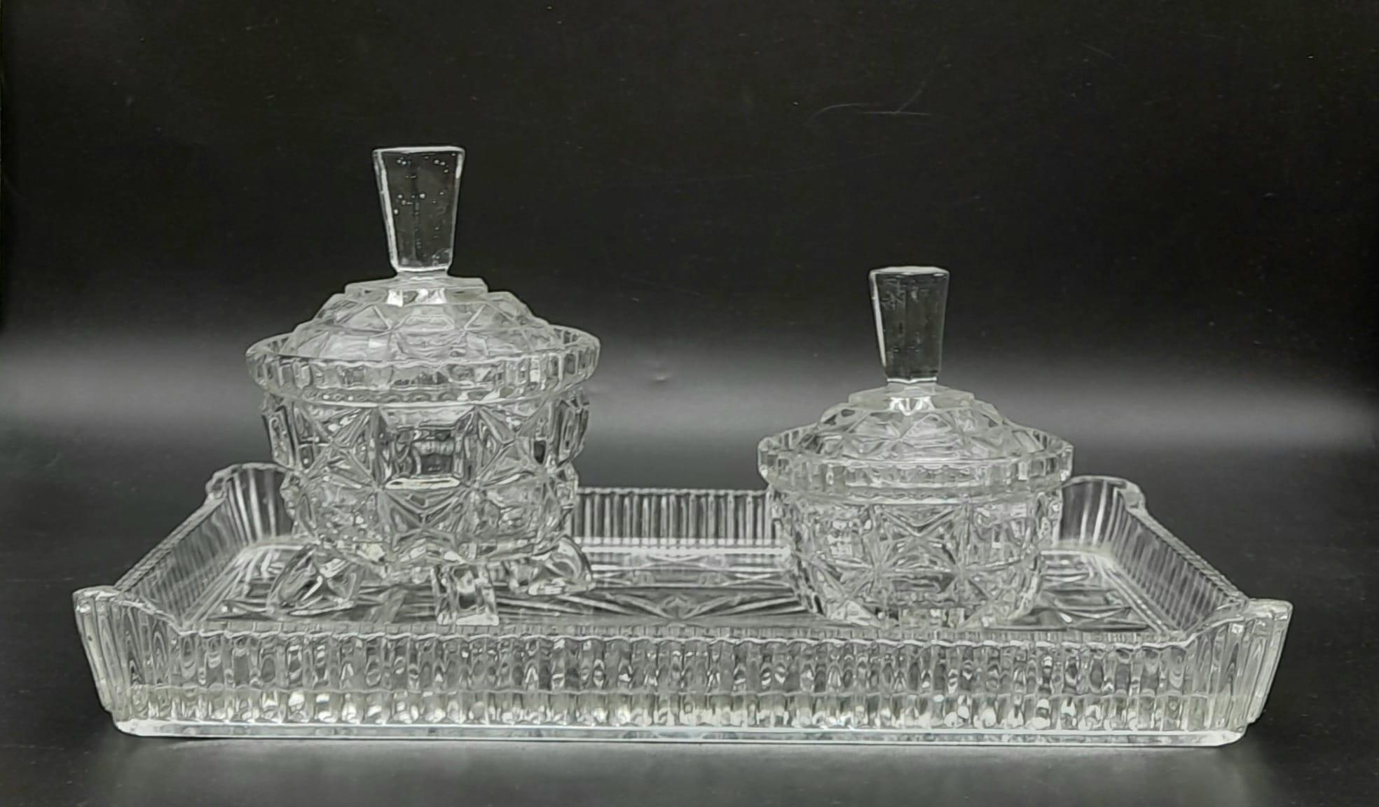 Cut glass serving tray with bon bon and sugar dishes. Tray measures 31x21cm, larger dish stands 15cm