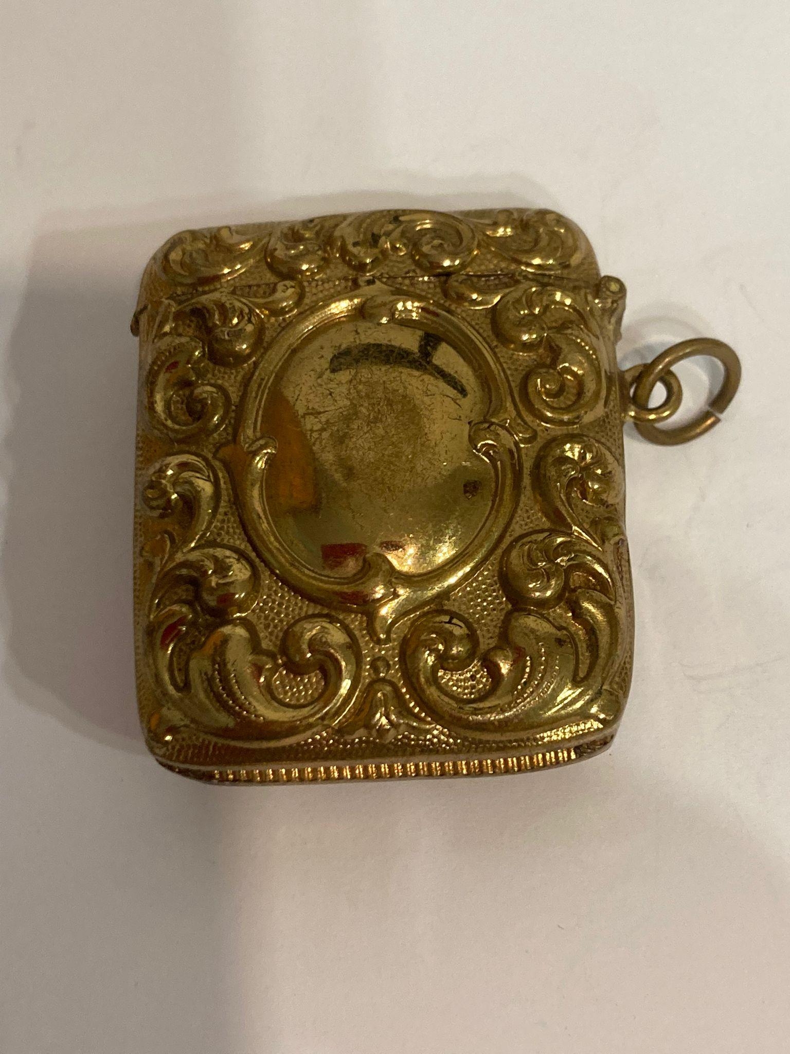 Rare Victorian 19th century BRASS VESTA. Having Repousse scroll design to both sides. Hinge and