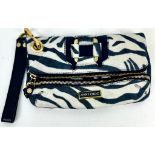 A Jimmy Choo Zebra Stripe Large Clutch Bag. Gilded hardware. Zipped inner and outer compartment.