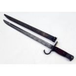 An Antique Japanese Bayonet with Scabbard. Markings for Koishikawa/Kokura on blade. 52817 marking on