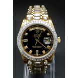 A Very Serious 18K Gold and Diamond Rolex Day/Date Gents Watch. 18k gold and diamond strap and