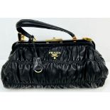 A Prada Black Gaufre Large Leather Hand Bag. Gilded hardware. Zipped inner compartment. 42 x 25cm.