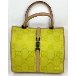 A Gucci Green Canvas and Brown Leather Monogram Handbag. Silver-tone hardware. Zipped interior