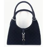 A Gucci Bardot Handbag. Monogram black canvas and leather. Chrome-effect hardware. Cloth interior