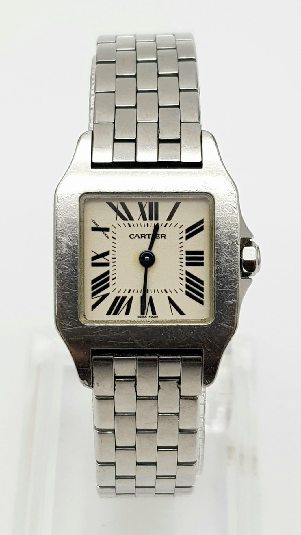 A Cartier Stainless Steel Small Tank Watch. Case - 20 x 30mm. White dial. Quartz movement in working