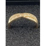 9 carat GOLD CROSSOVER RING,DIAMOND SET. Full UK hallmark. 2.11 grams. Size O. Complete with ring