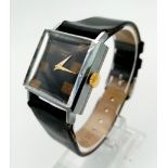 A stainless steel CHOPARD ladies watch with leather strap. 25 x 25 mm case, black dial with tiger'