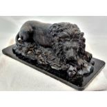 A Vintage, Possibly Antique Bronze Sculpture of a Resting Lion. Black patinated finish. Black marble
