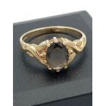 9 carat GOLD RING having large SMOKEY QUARTZ SOLITAIRE mounted to top. 2.16 grams. Size O.