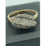 Ladies antique 18 carat GOLD and DIAMOND RING in crossover style having DIAMONDS Mounted in PLATINUM