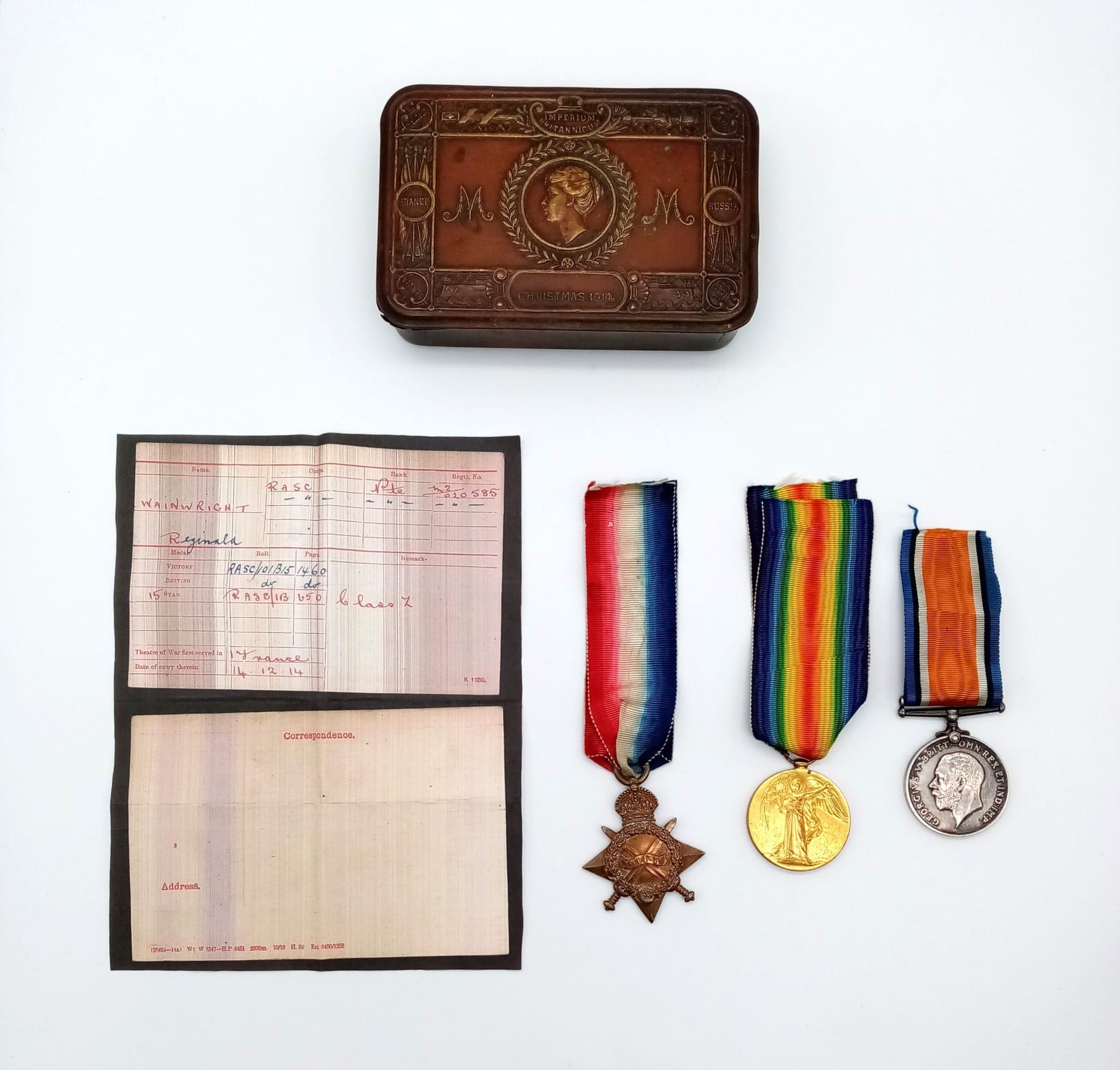 A WW1 British Medal Trio in a Princess Mary Christmas Gift Tin. Awarded to: M2-020585 Pte R.