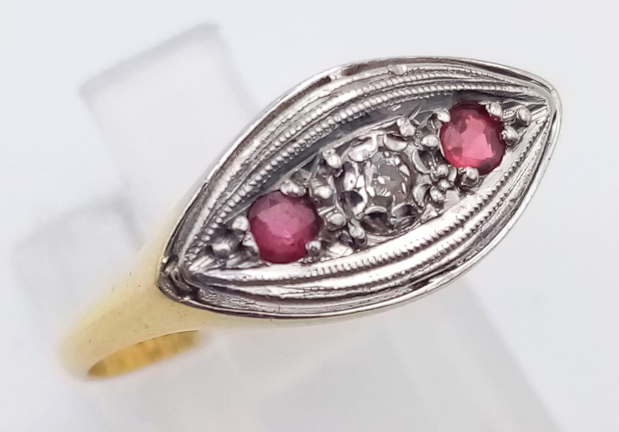 A vintage 18K yellow gold and platinum ring with a single diamond and two rubies. Ring size: R, - Image 2 of 7