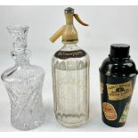 A Vintage Schweppes Soda Dispenser a Lead Crystal Decanter Plus a Big Brand Cocktail Shaker.