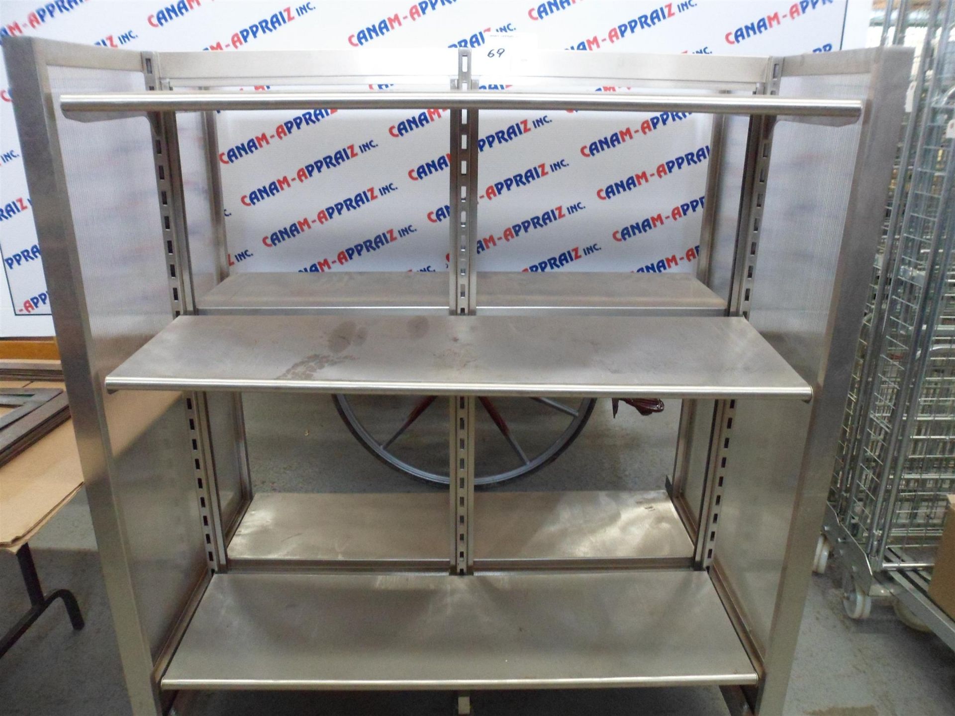 STAINLESS STEEL DISPLAY CASE ON CASTERS