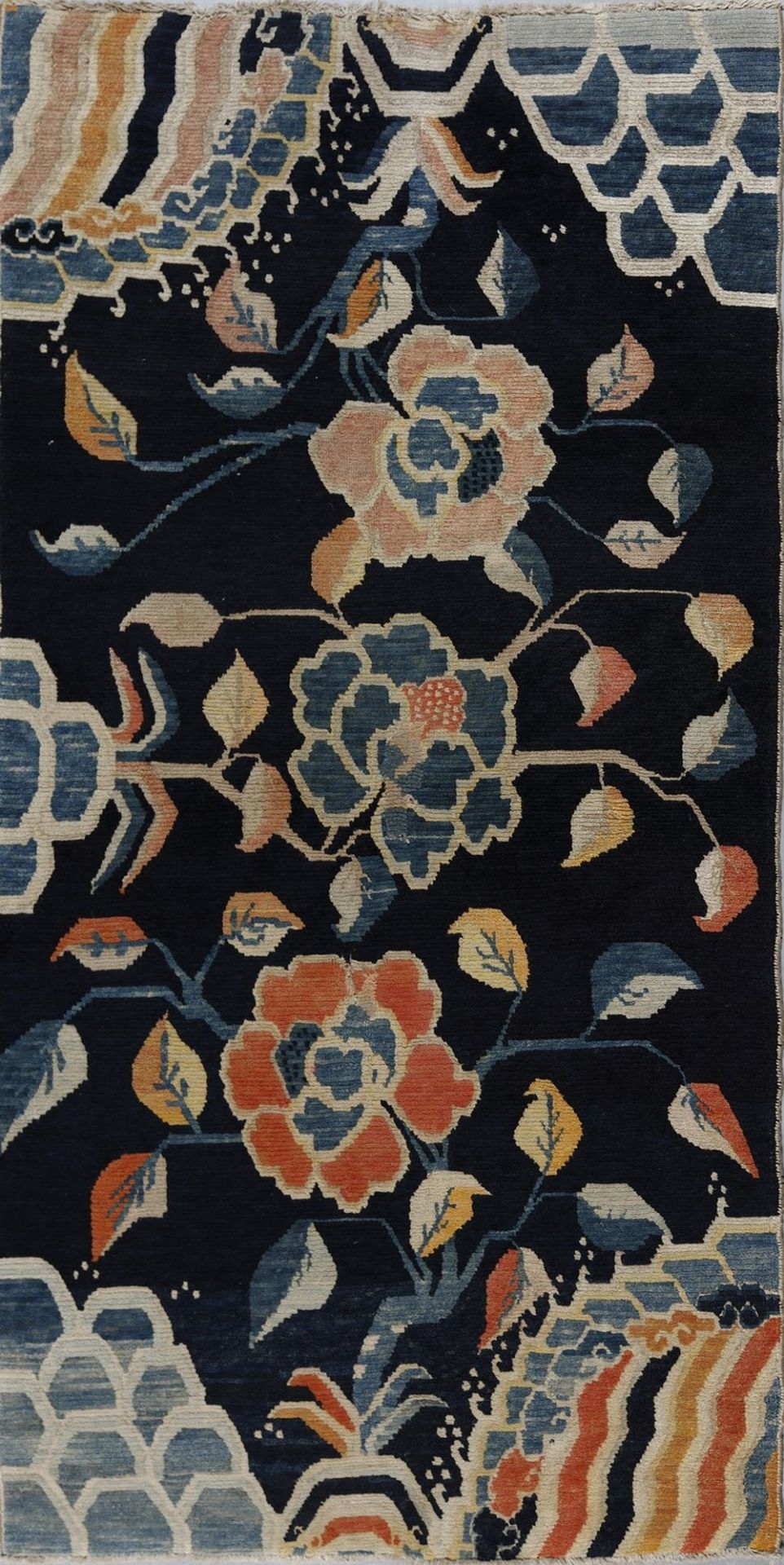 .  A Tibetan rug with peonies early 20th century .