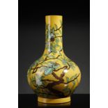 Arte Cinese A porcelain bottle vase over yellow ground China, 20th century .