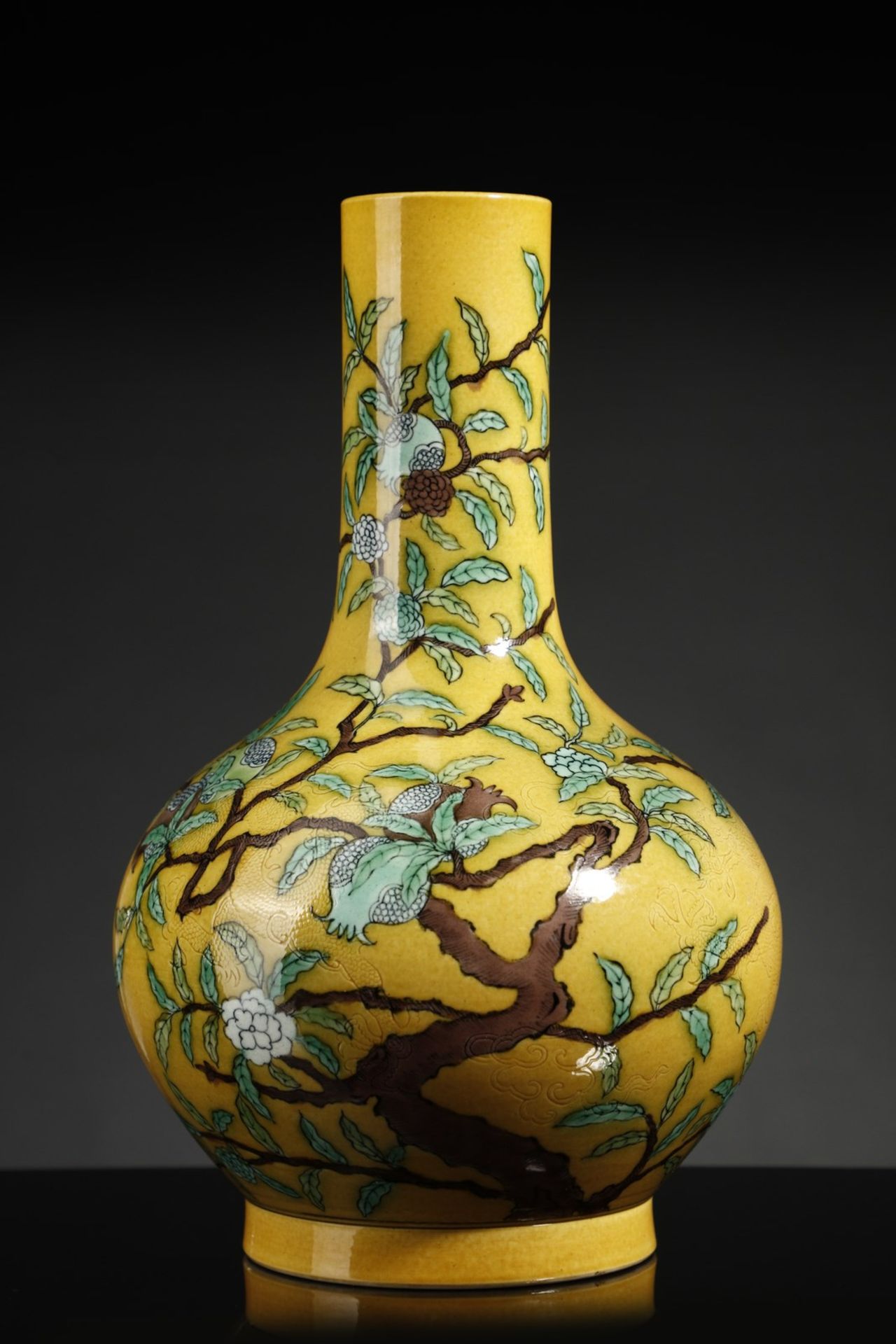 Arte Cinese A porcelain bottle vase over yellow ground China, 20th century .