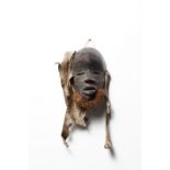 Arte africana Three Kpelie, Deangle maskSenufo, Dan - Ivory Coast.
