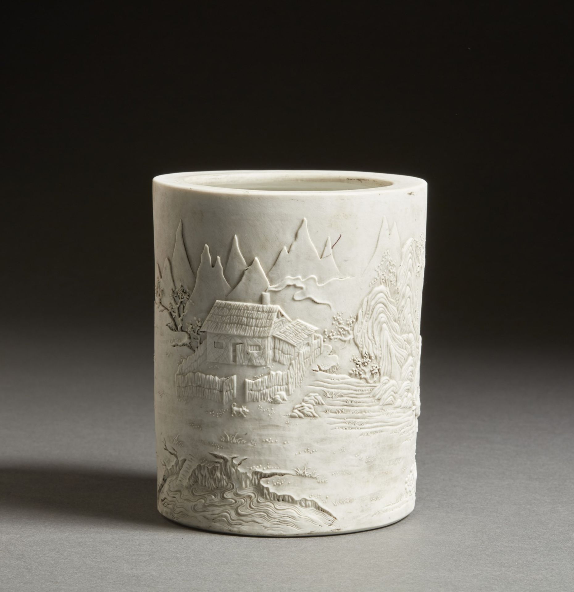 Arte Cinese  An unglazed white pottery brushpot bearing a Qianlong zhuanshu six character mark at th