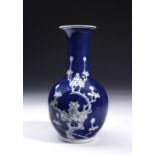 Arte Cinese A blue glazed porcelain vase decorated in reserve and bearing a Jingdezhen mark at the