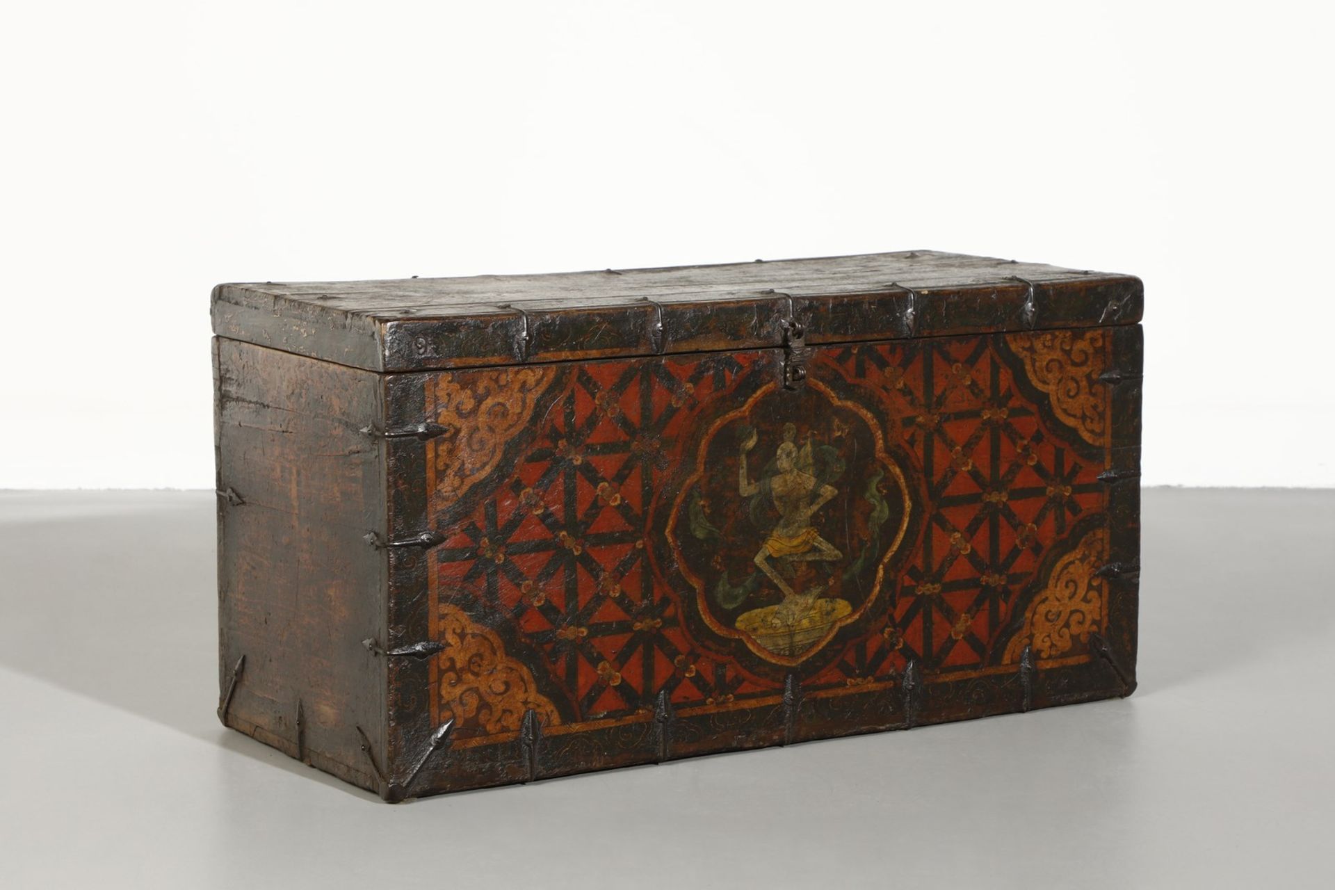 Arte Himalayana A polychrome wooden chest painted with dancing skeleton over red knotted background