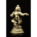 Arte Indiana A brass BalaKrishna figure India, Orissa, 17th century .