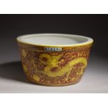 Arte Cinese A pottery fishpot painted with yellow dragons over red ground and bearing a spurious Ji