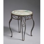 Arte Cinese An iron mounted table with a famille rose porcelain top China, Republic period .