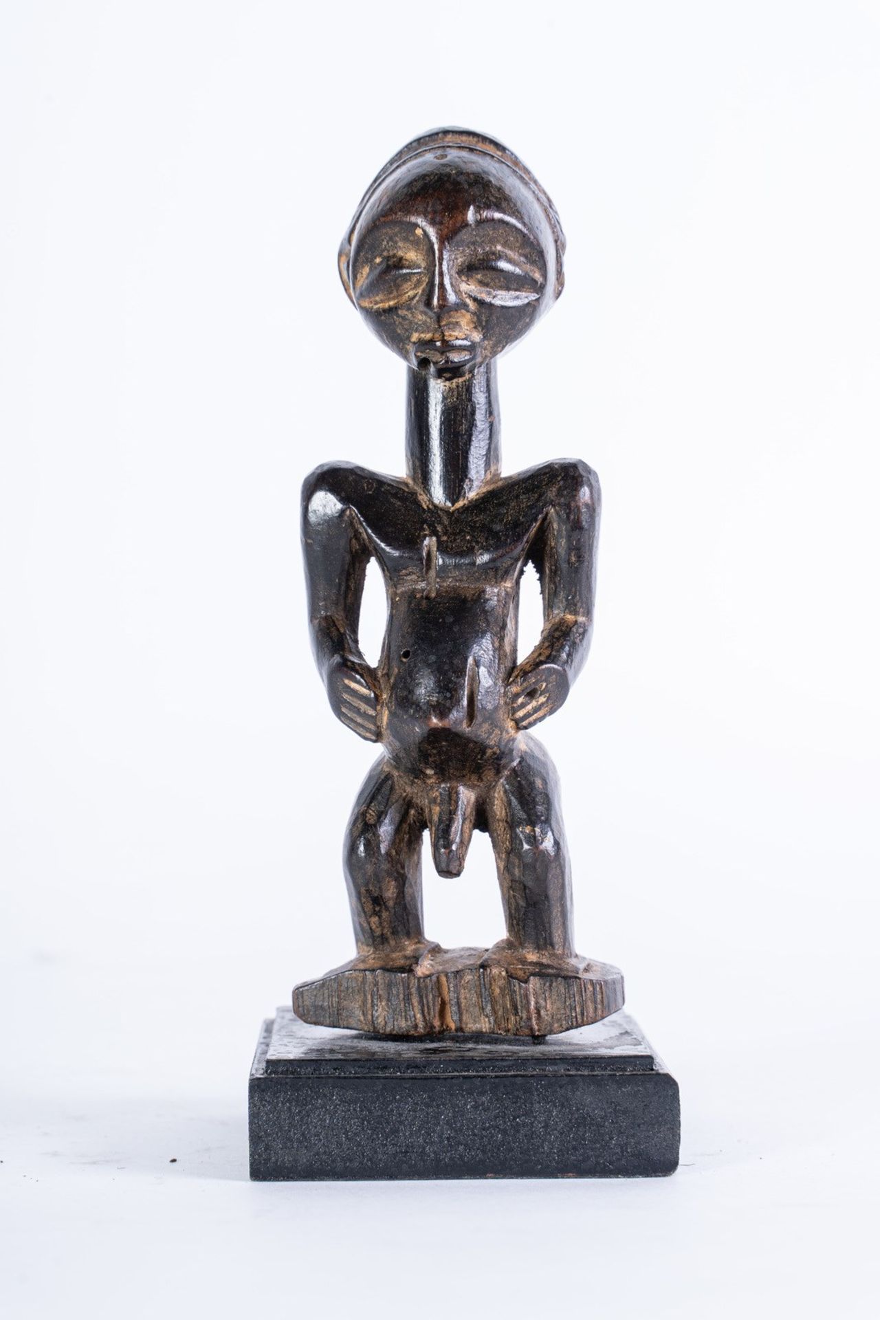 Arte africana A male figure, Luba D.R.Congo in dark patina wood.
