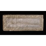 Arte Islamica A partially gilt silver Ottoman epigraphic plaque embossed with the bismillah and win