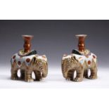 Arte Cinese A pair of elephant shaped pottery candlesticks bearing a Qianlong six character seal ma