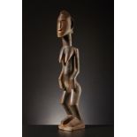 Dogon - Mali Female figure of ancestor.Hard wood with clear and glossy patina, with traces of pigm