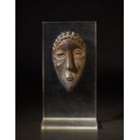 Bassa - Liberia Miniature mask.Hardwood with dark patina.Signs of use.on a plexiglass support.